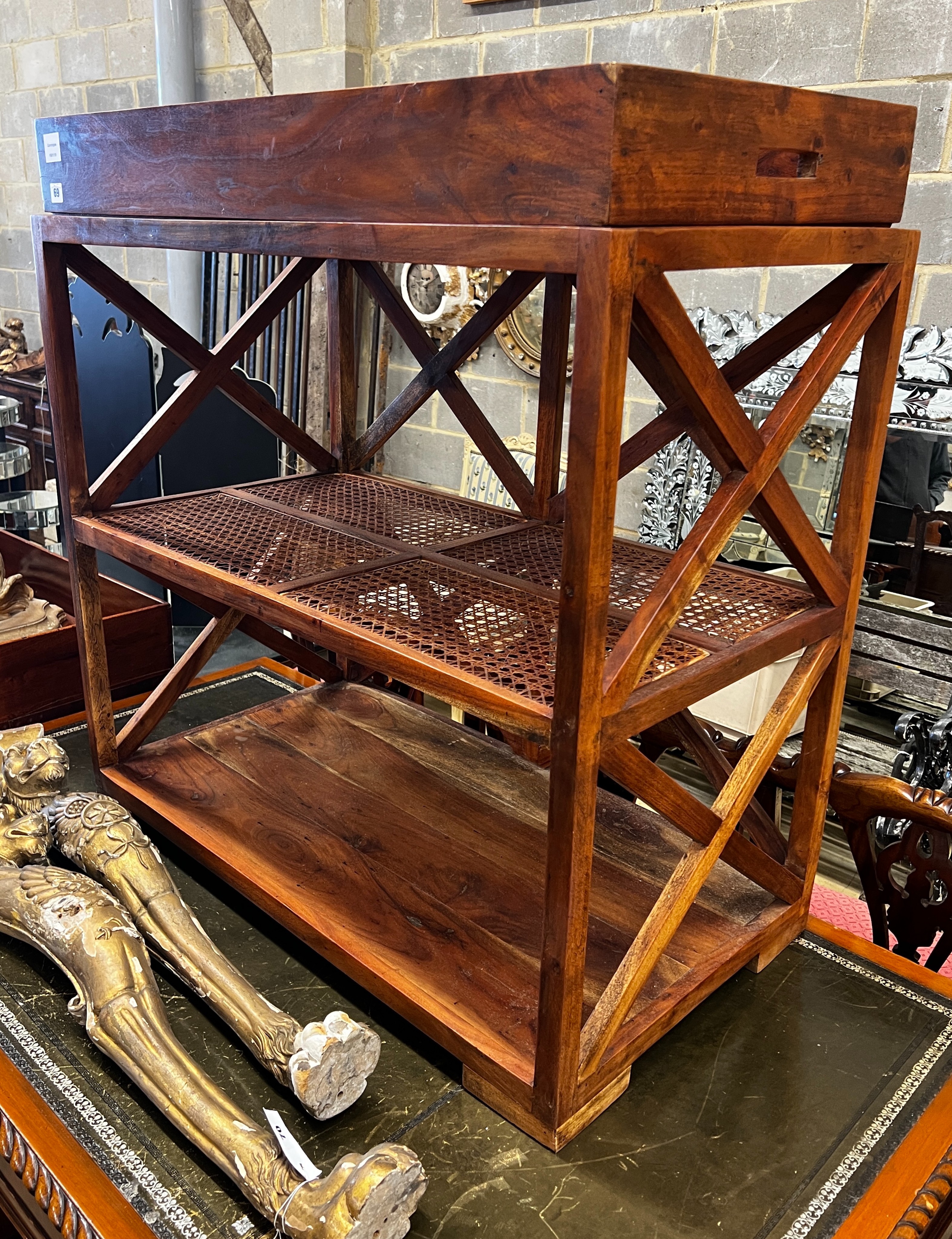 A hardwood and canework tray top three tier table, width 92cm, depth 50cm, height 96cm